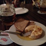 Cheese in oil with bread and beer